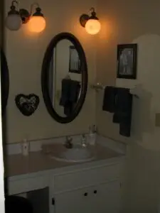 A before photo of a vanity in need of a makeover, both stylistically and functionally