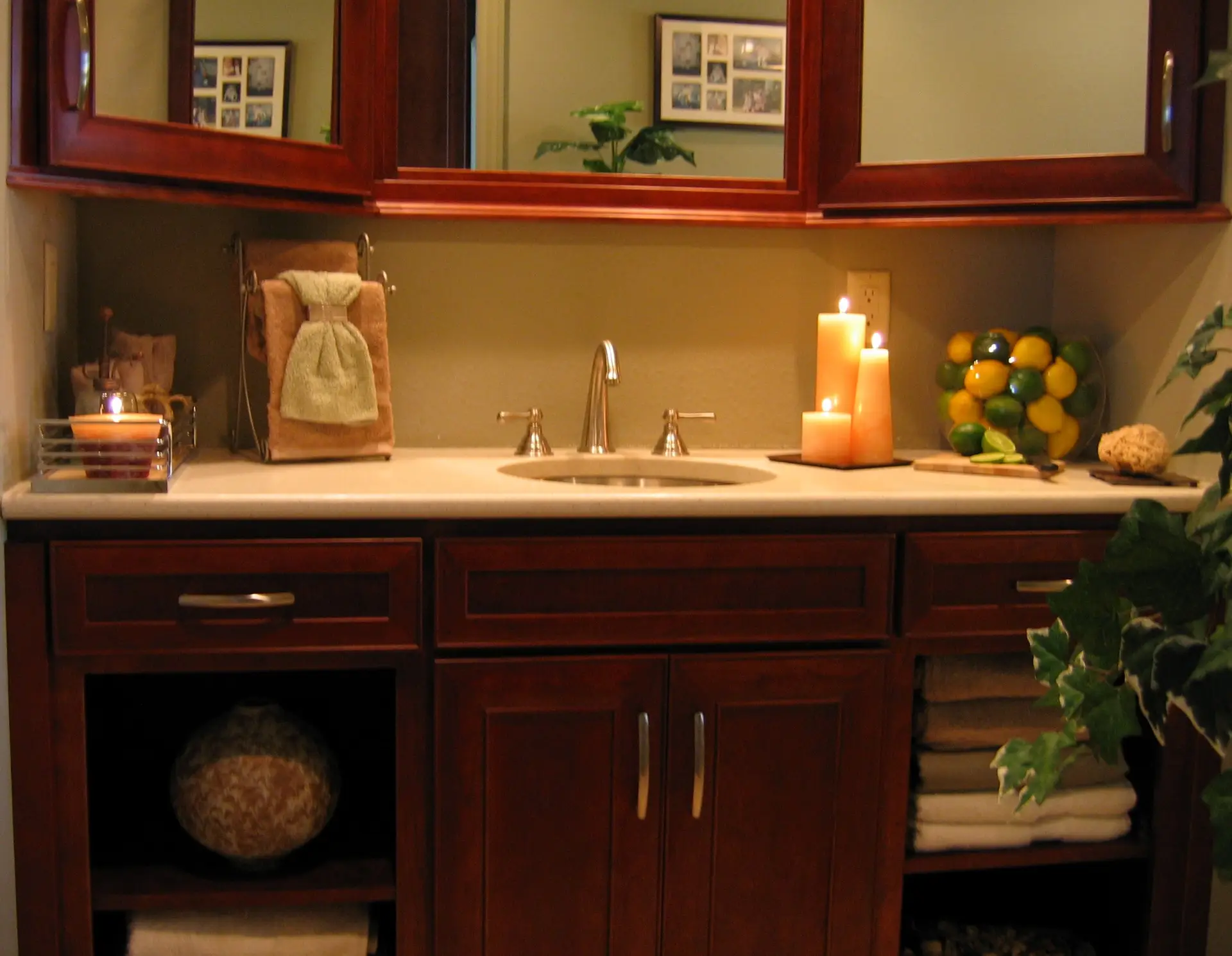 Decorative towel storage on open shelves under a bathroom vanity