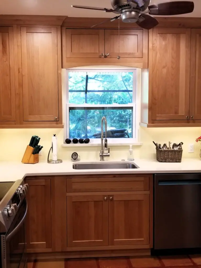 Never use anything abrasive when washing wood cabinets like the ones pictured