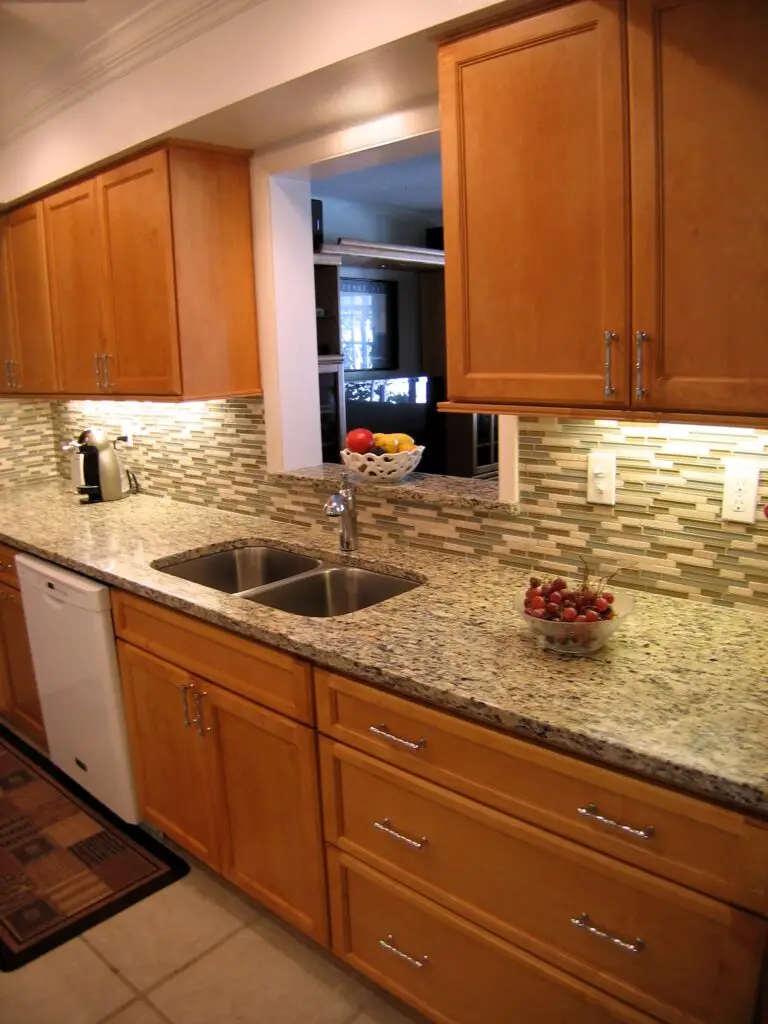 The best cleaning product for these wood cabinets is as simple as a mixture of vinegar and water