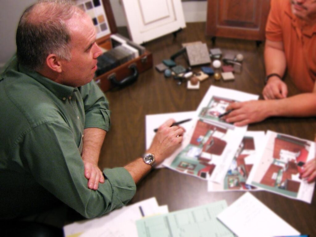 Kitchen designer consults with a homeowner to create a personalized, ergonomic kitchen plan