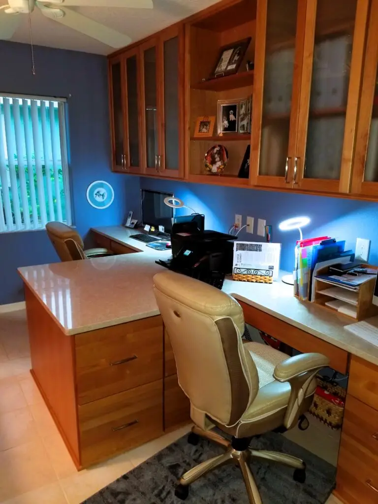 An unused bedroom transforms into a home office for two with plenty of storage