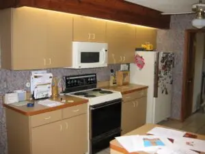 Before photo of a dated kitchen in Palmetto. This closed off wall will be opened up