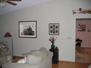 Before photo of a partition wall separating the kitchen from the living room