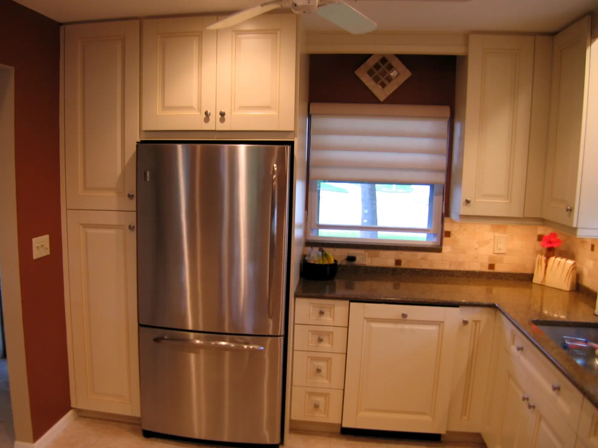 Custom pantry and refrigerator alcove for efficient storage in a small kitchen