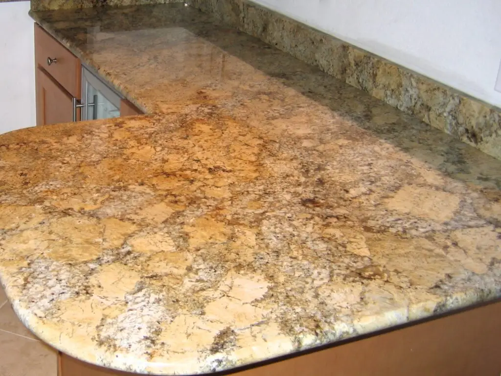 golden beach granite countertops in a remodeled kitchen