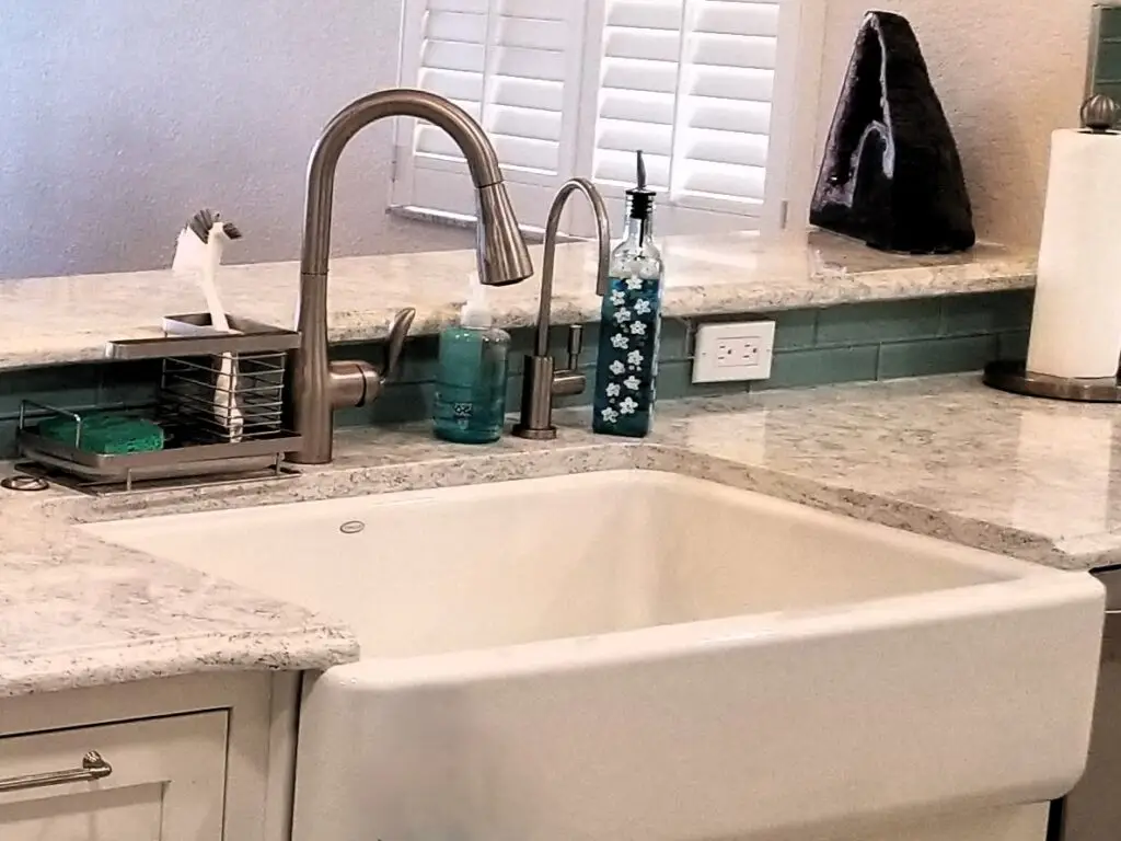 An apron front sink and gooseneck faucet which will be out of commission during a kitchen remodel