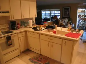 Before photo of white cabinet and white laminate countertop