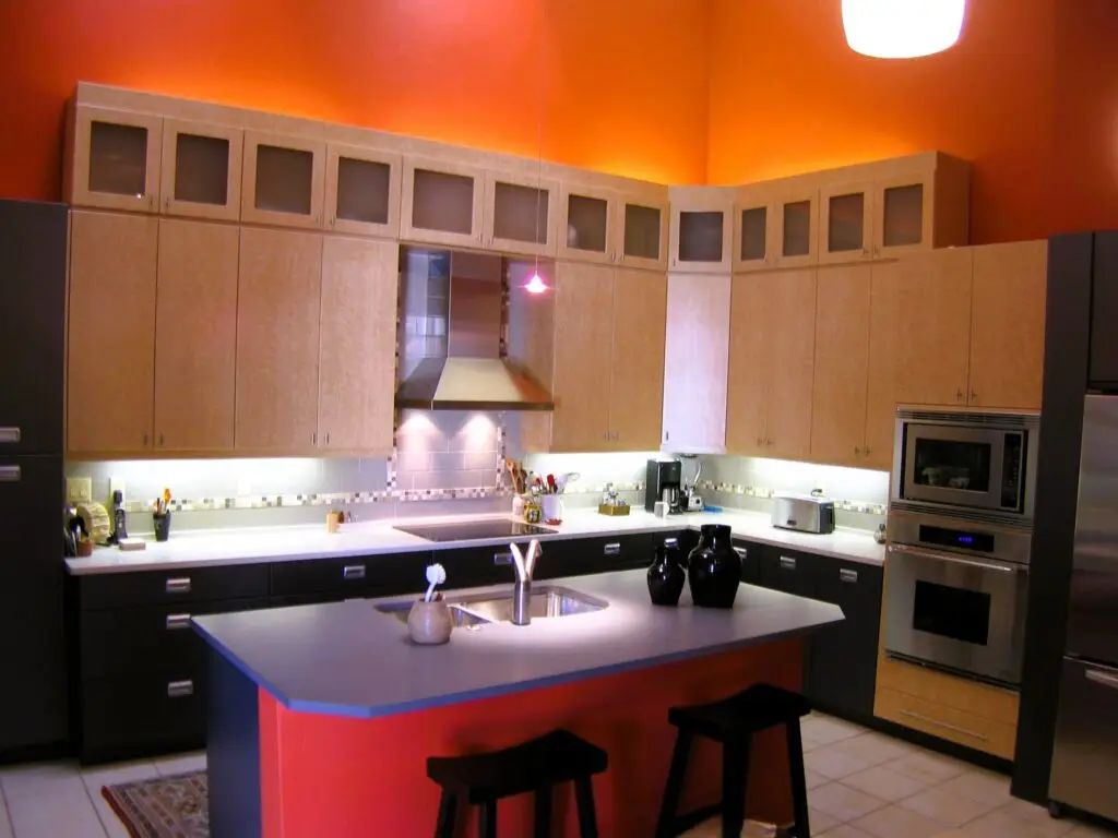 Bold kitchen remodel in Prestancia Sarasota with Birdseye maple and charcoal cabinetry