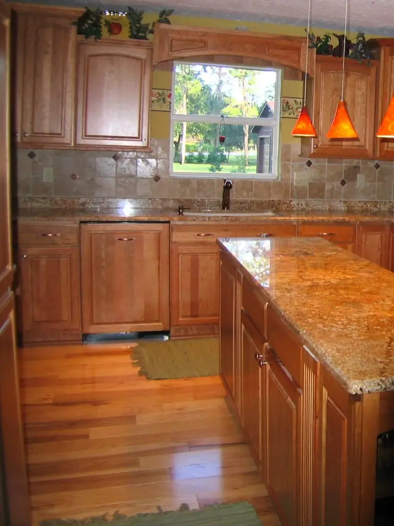 Cherry StarMark cabinetry with Juparana Persa Gold granite countertops