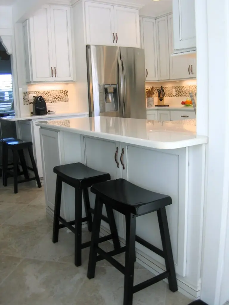 Longboat Key cottage kitchen remodel with StarMark cabinetry and Cambria countertops