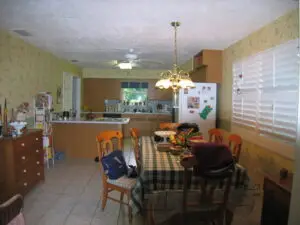 Original 1970s kitchen with peninsula and dated cabinetry