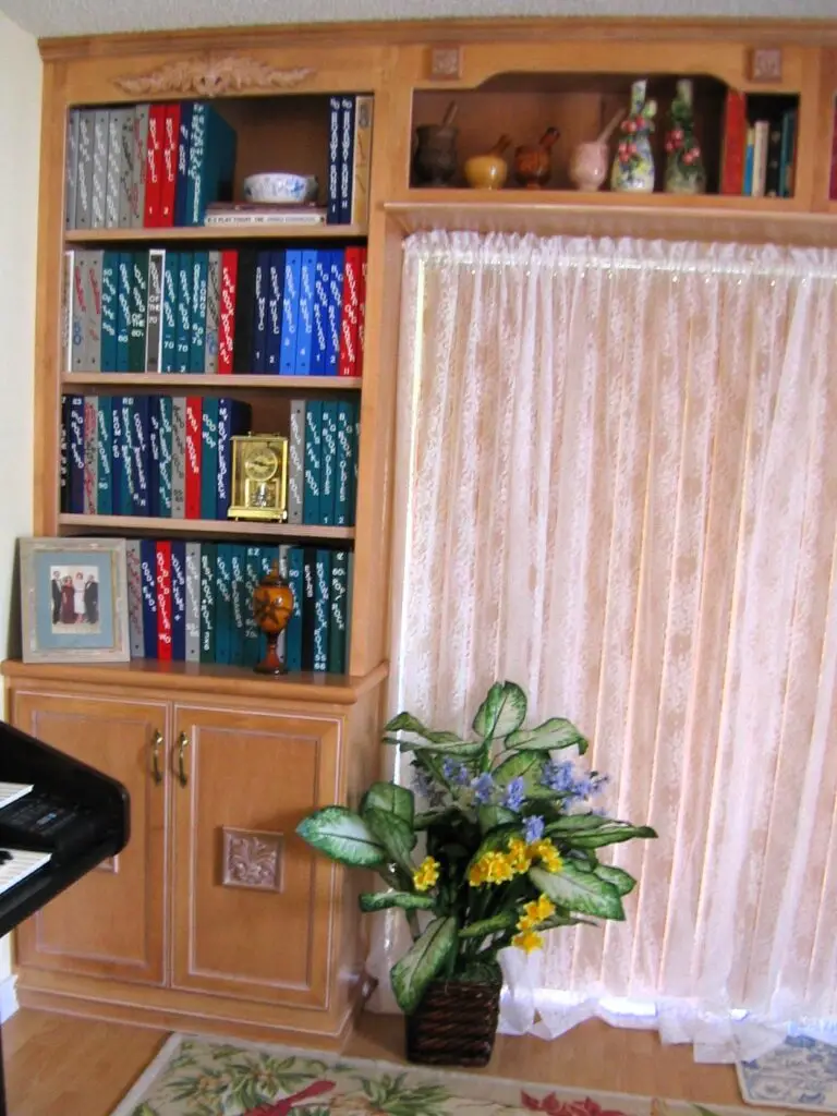Close-up of StarMark maple cabinetry with decorative onlays and a white glaze