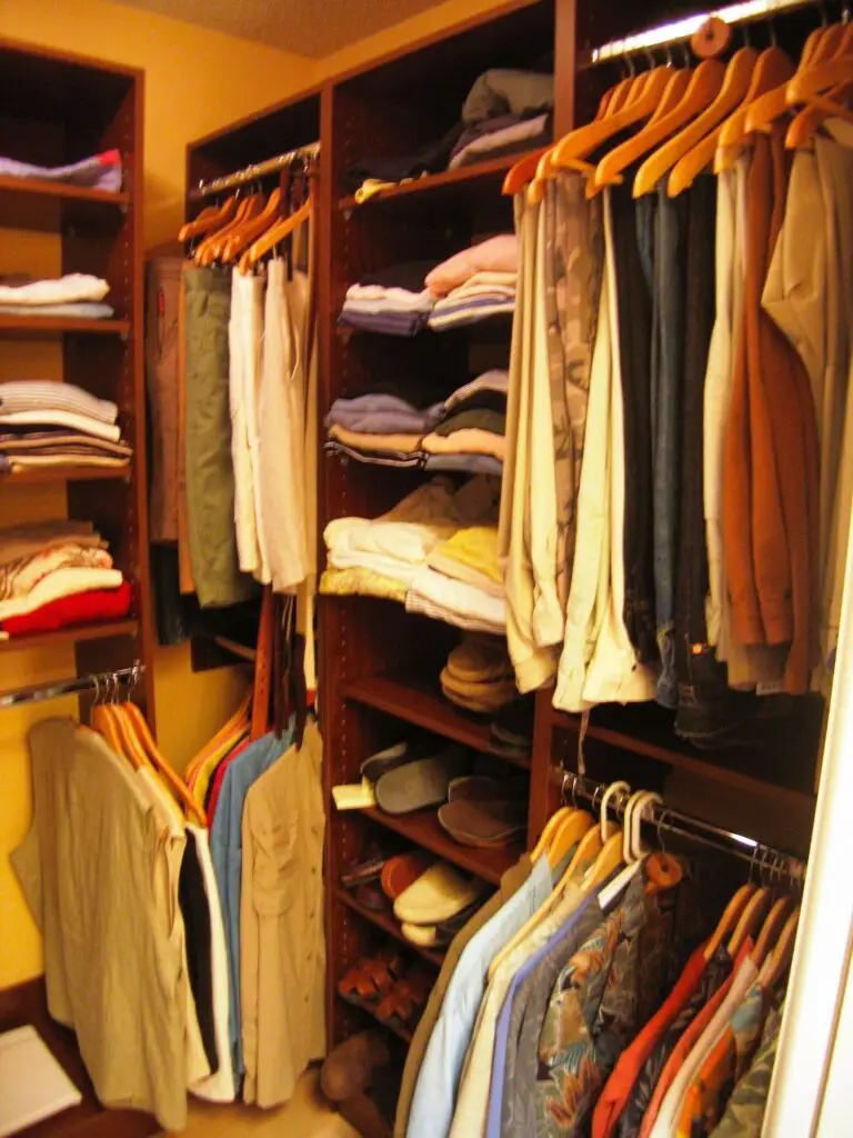 Right wall of a custom closet showing a mirrored layout with hanging space and shelves