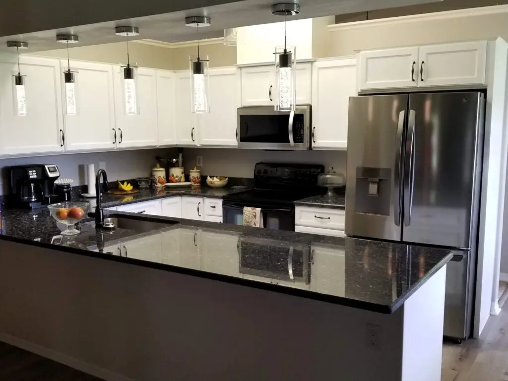 A modern neutral kitchen with white cabinets