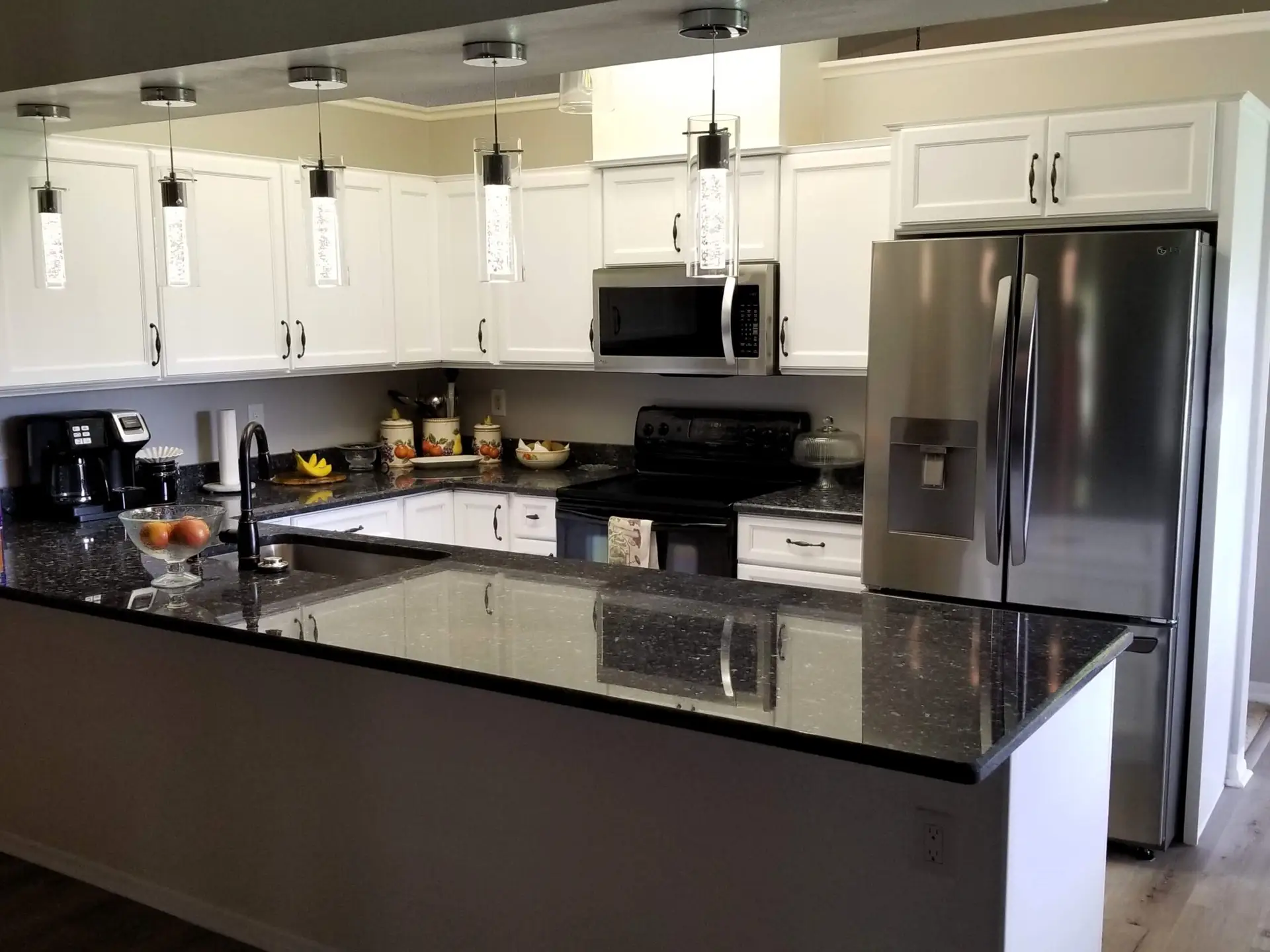 A modern neutral kitchen with white cabinets
