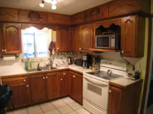 Separating wall in the kitchen creates a dark kitchen in this before photo