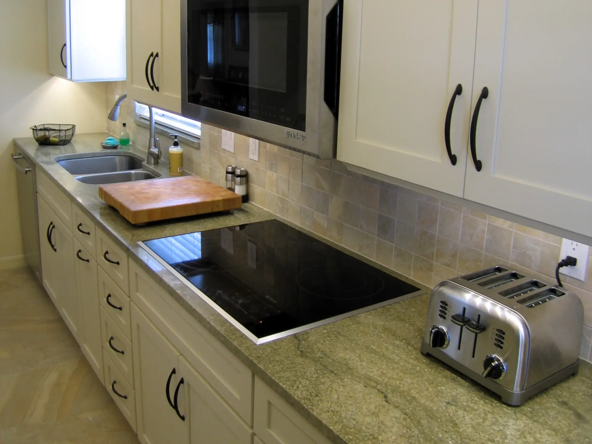 Everything a serious cook could want in a recent kitchen remodel featuring Stressless Cabinetry and Green River granite