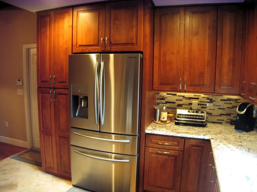 A pantry cabinet cleverly conceals the refrigerator and creates a custom, built-in look