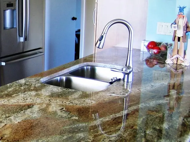 Sleek, undermount single bowl kitchen sink in a durable stainless steel material