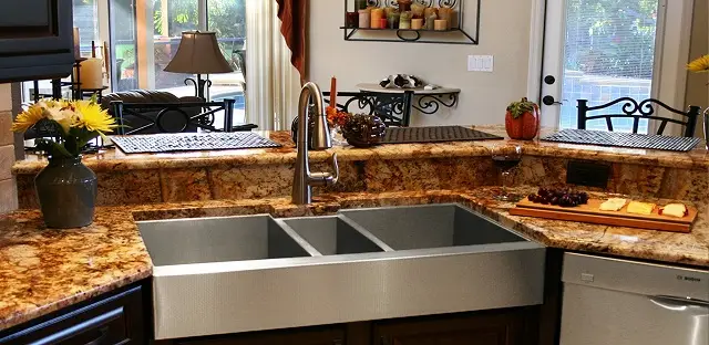 Triple bowl apron front sink in stainless steel combines function and aesthetics