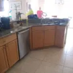 before photo of kitchen peninsula and sink area