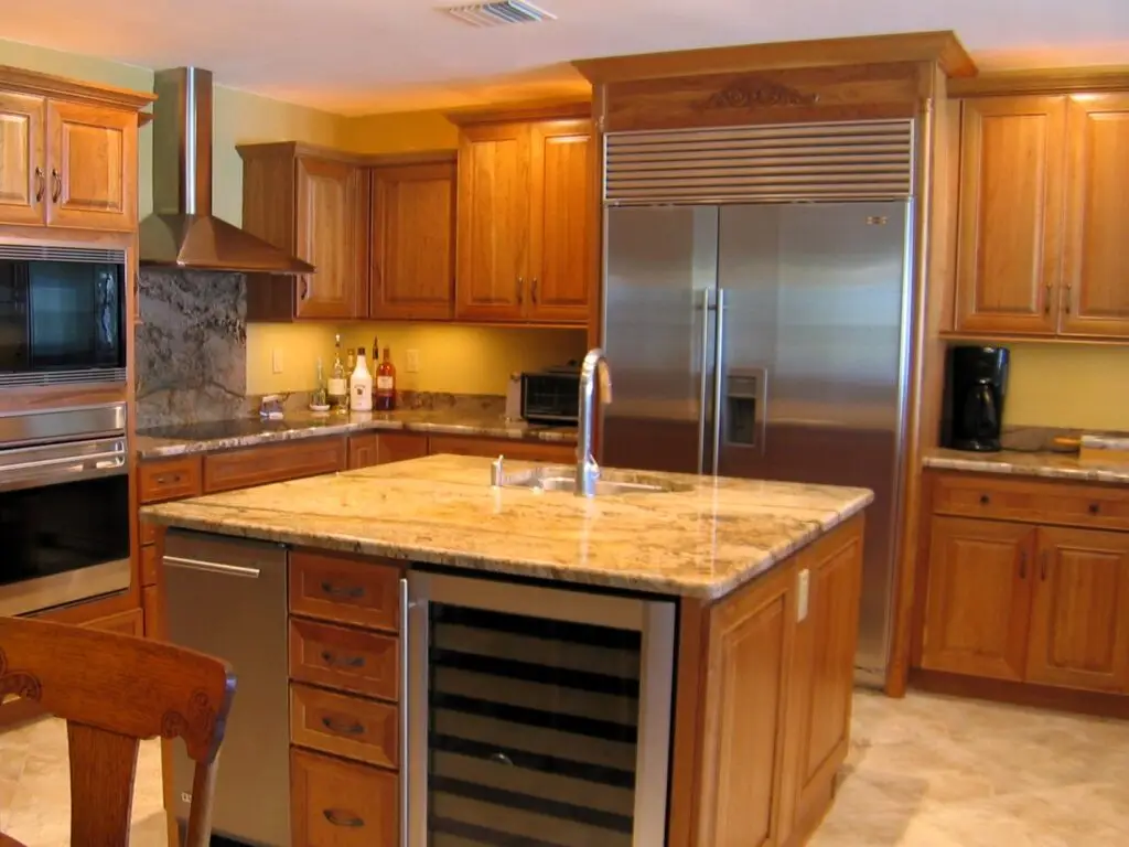 A modern kitchen featuring full overlay cabinets with sleek, clean lines and a minimalist feel