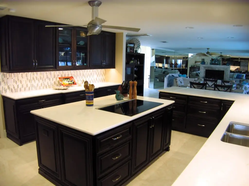 A spacious kitchen island with a clean countertop and built in storage. Ideal for a family kitchen