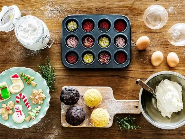 holiday baking in full swing with cookies and the supplies to decorate them