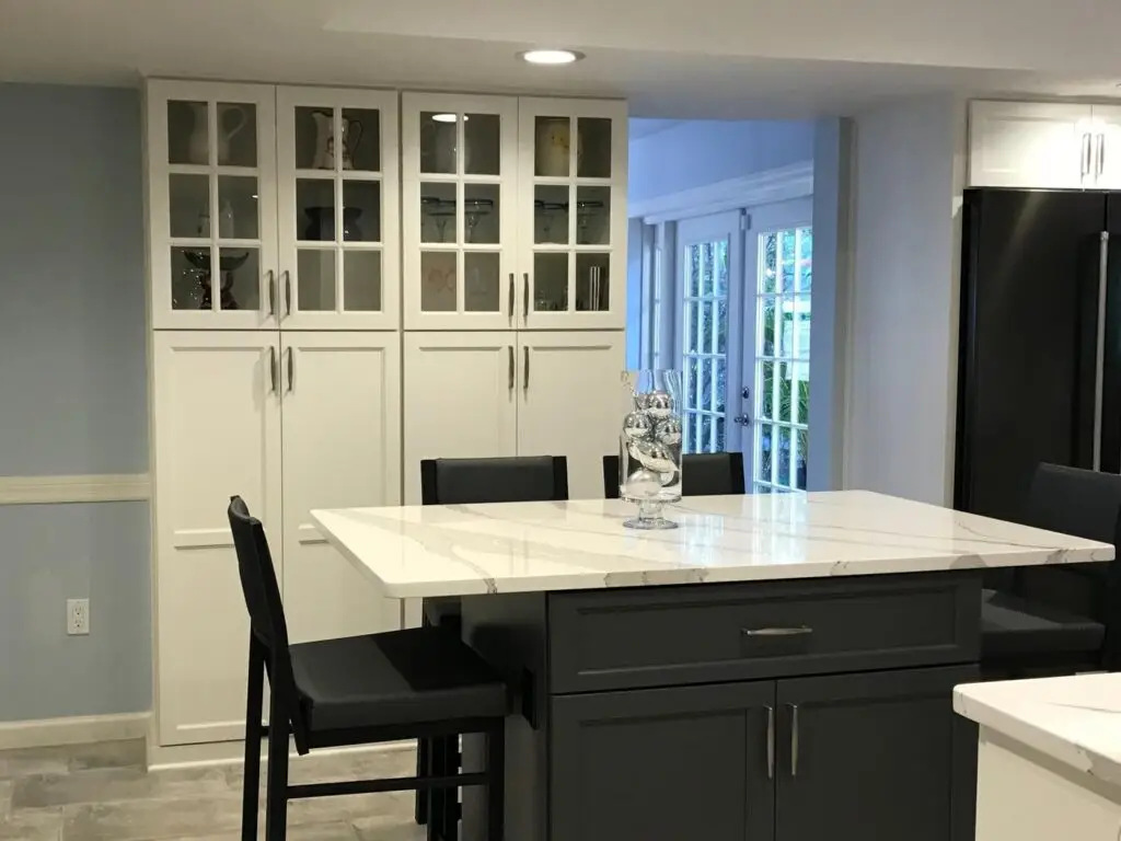 A kitchen island shown in this recent kitchen remodel, can serve a variety of functions, from seating to storage. Meal prep to cleanup.