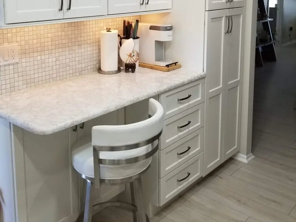 Thinking through how your physical needs might change in the future will allow you to age gracefully at home without needing additional assistance. A great option would be seating in the kitchen work area, as shown in this recent condo kitchen remodel.