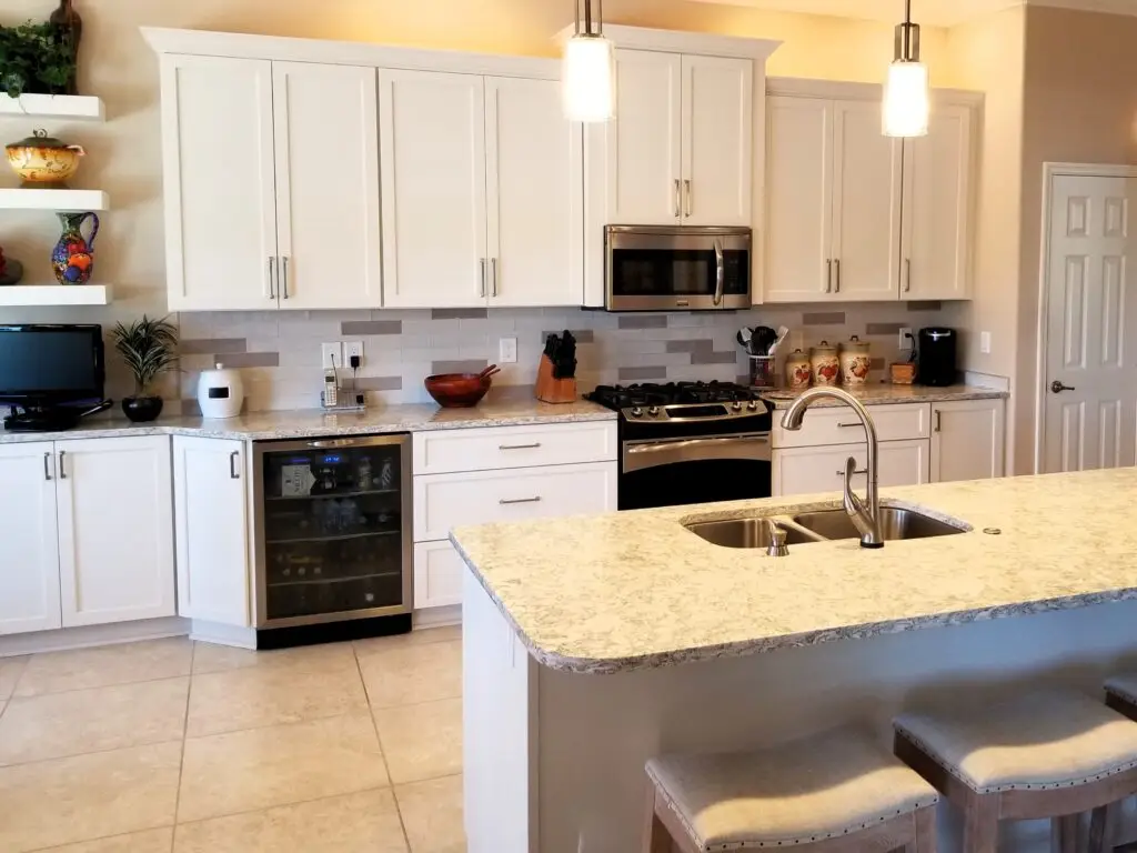 Professional installation of new cabinets on existing tile kitchen floor