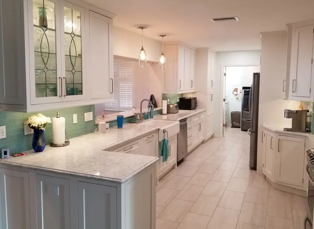 Kitchen design with white cabinets and quartz countertops