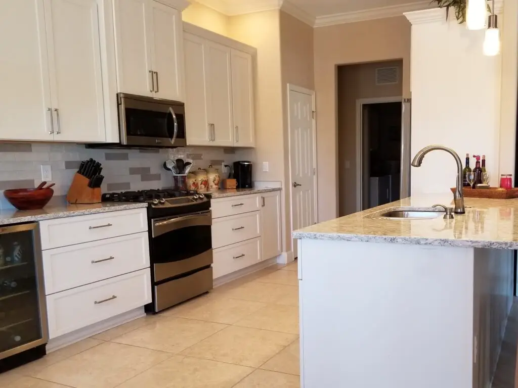 Custom kitchen cabinets by Duncan's Creative Kitchens showcasing elegant painted finish and detailed craftsmanship.