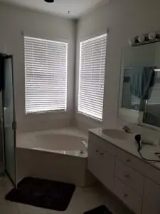 Before photo of a cramped and dated master bath in Lakewood Ranch