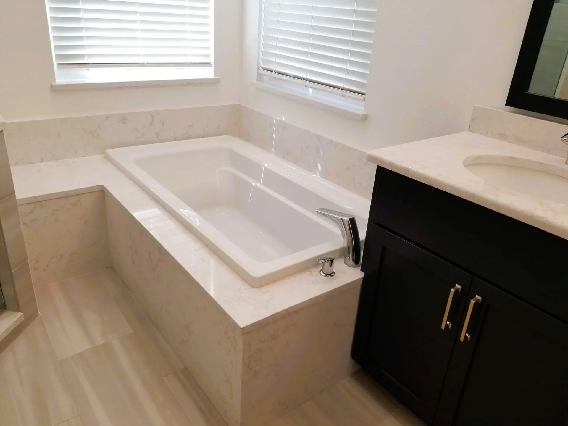Close-up of a Kohler soaking tub with an integrated bench