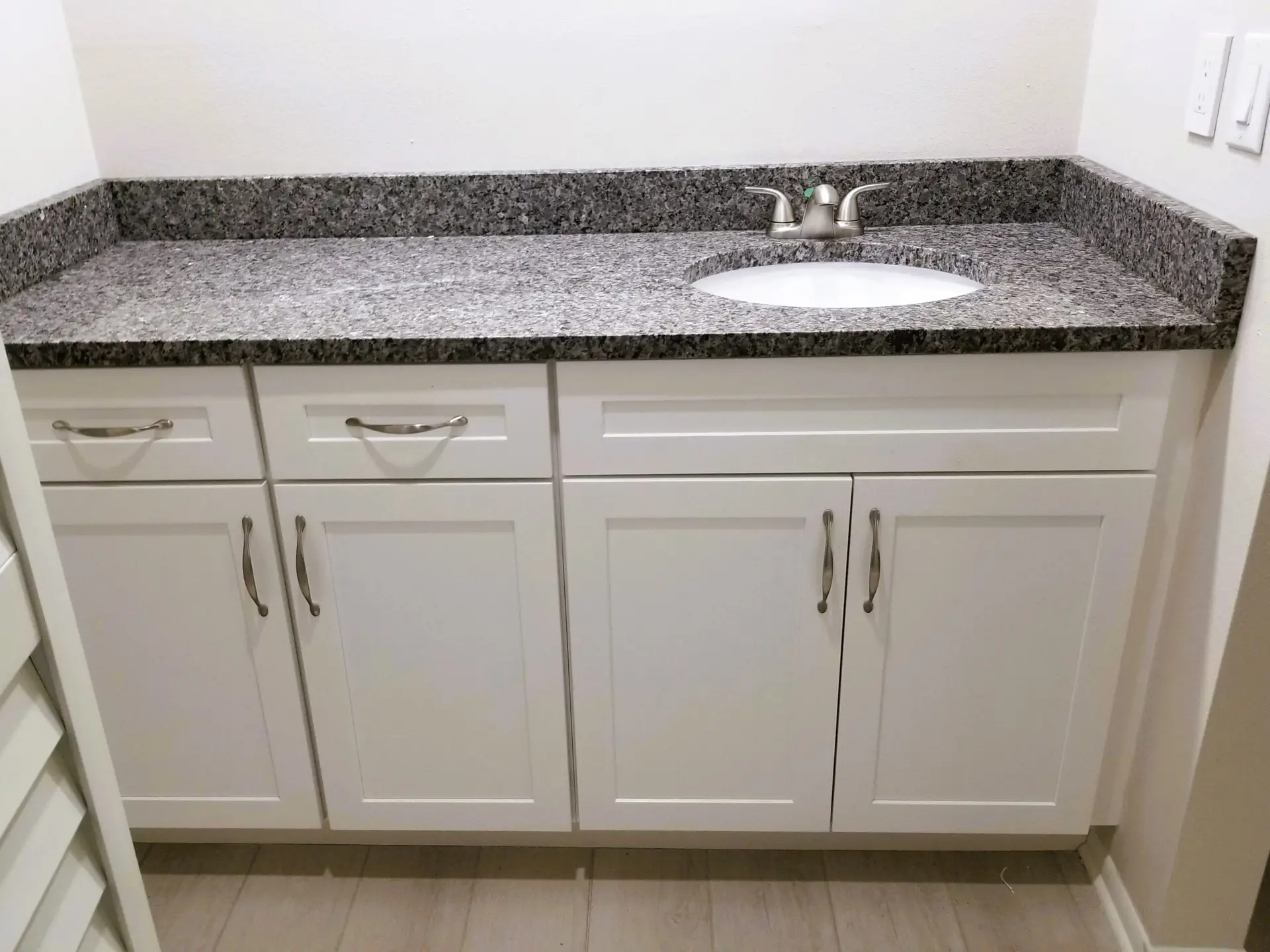 Master bath vanity with asymmetrical sink layout