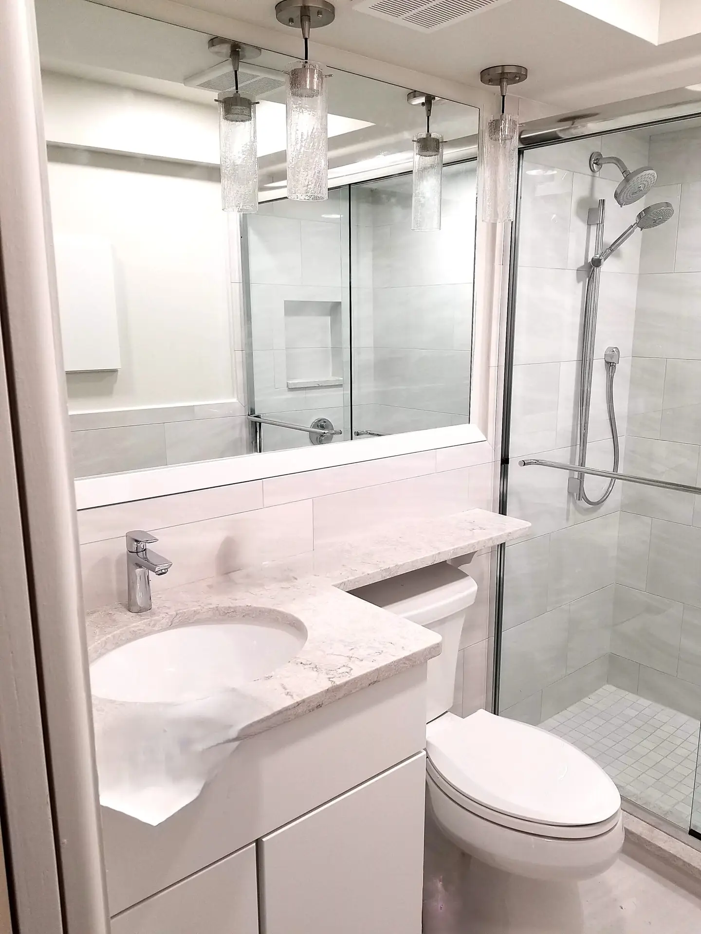 New vanity and toilet in remodeled hall bathroom
