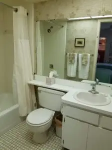 Original master bathroom vanity and toilet in Holmes Beach condo