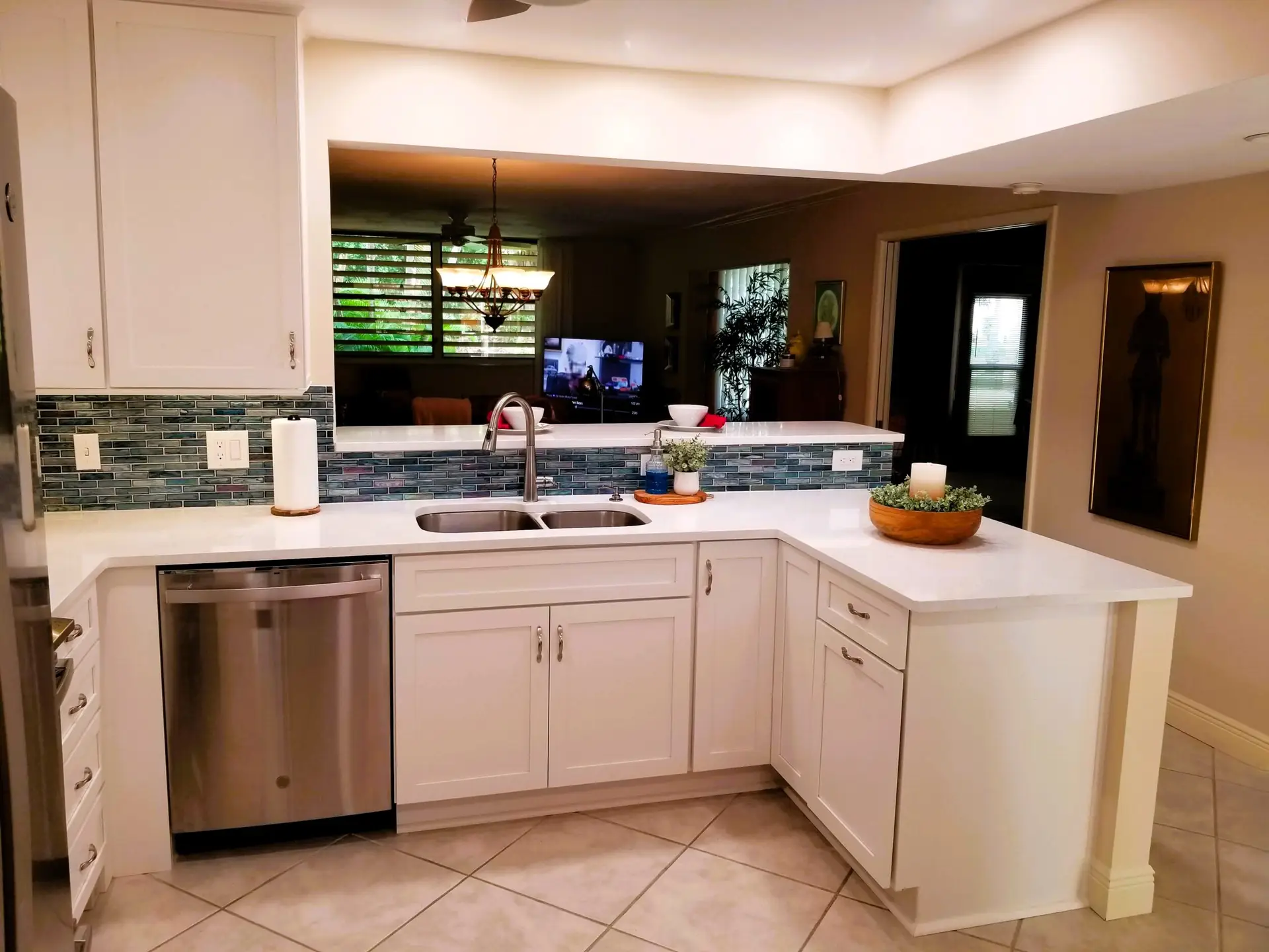 Wildewood Springs kitchen after remodel with iridescent tile backsplash