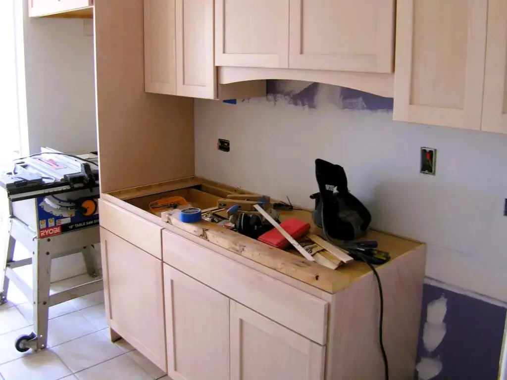 cabinets being installed in a remodeled kitchen