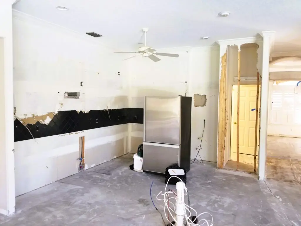 demolishing an old kitchen, showing the first physical step in a kitchen remodel