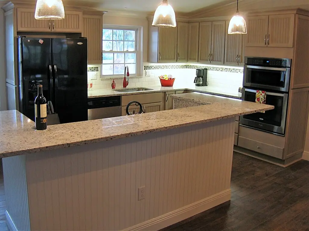 An affordable and functional kitchen renovation with semi custom cabinets and entry level granite