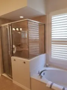 An adequate but inconvenient shower in this before photo of a master bath remodel in Bradenton