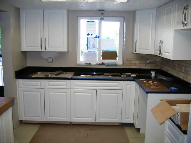 Building Permits posted in the window on a Bradenton kitchen remodeling site