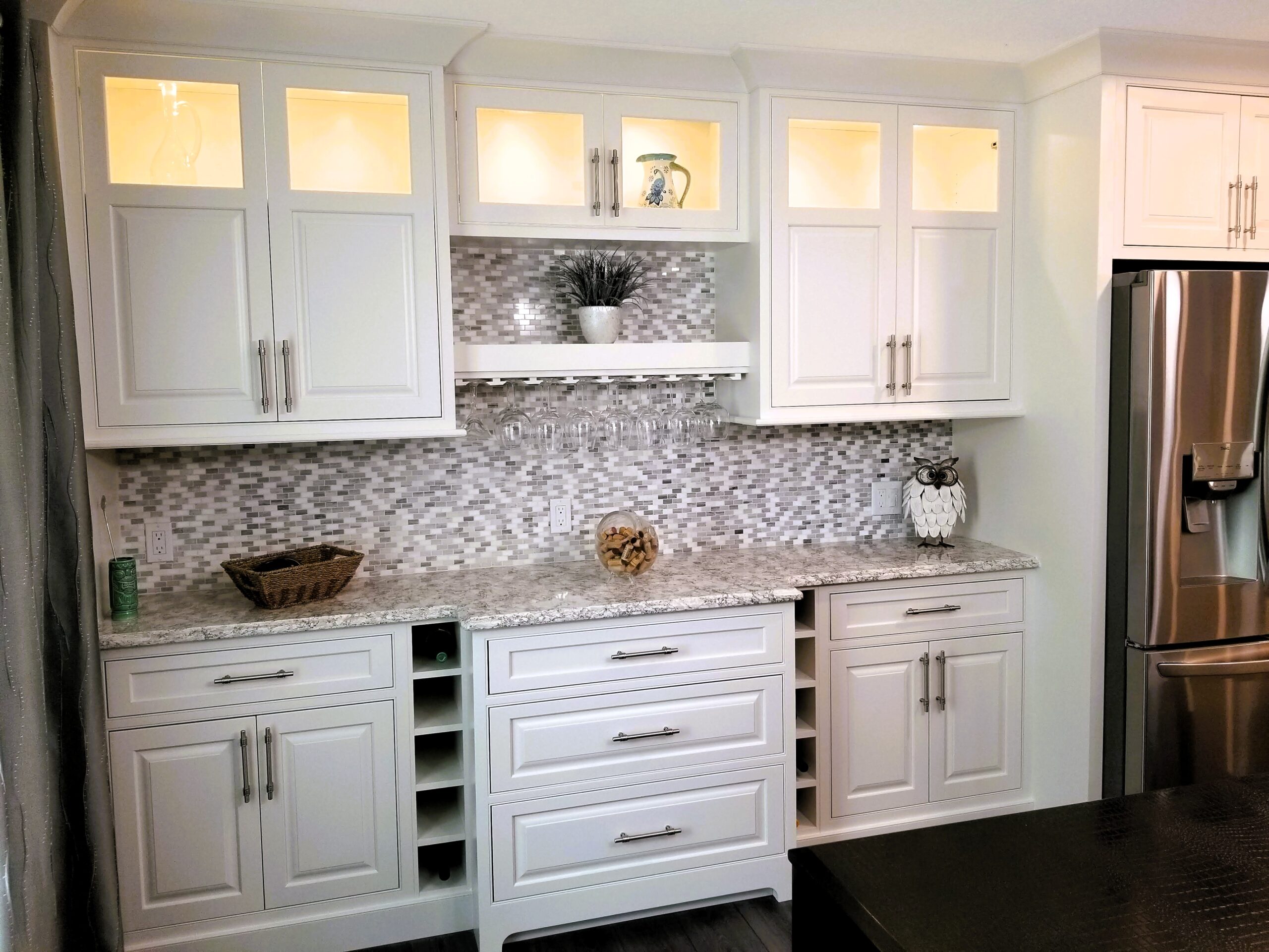 Built in dining buffet and dry bar with glass doors and wine storage in Palmetto great room