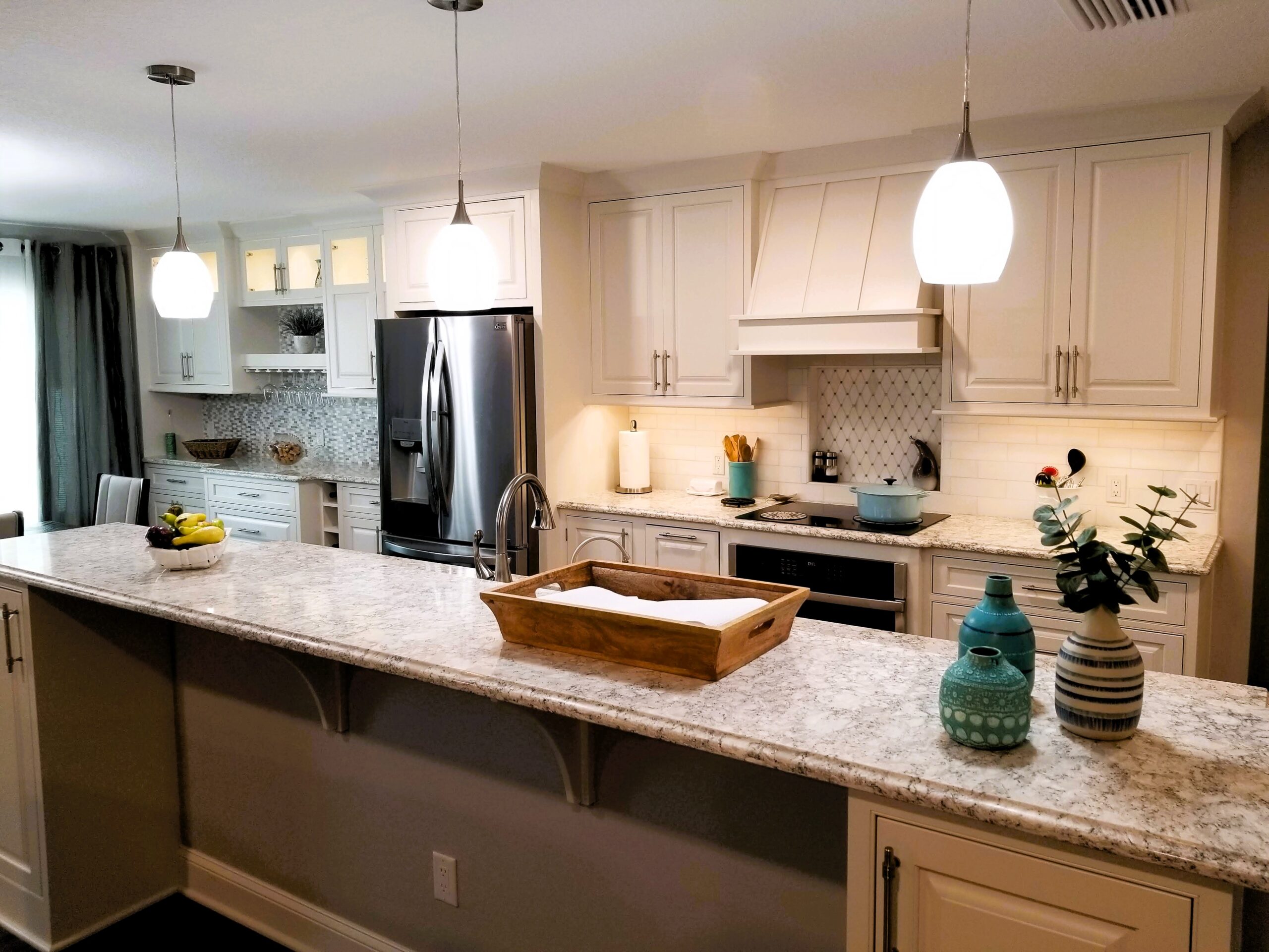 StarMark Inset cabinetry and Cambria Pendle Hill countertops in this Palmetto kitchen remodel
