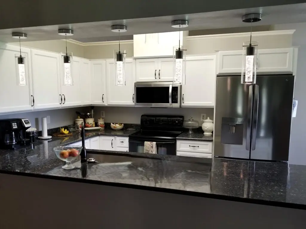 Stressless Cabinets and entry level granite create an affordable kitchen remodel in this after photo