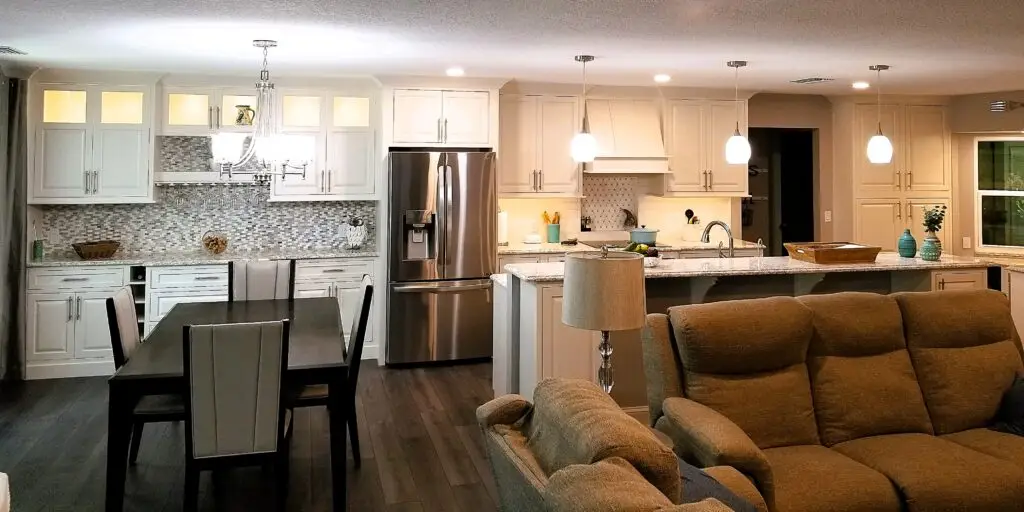 Wide view of Palmetto kitchen remodel with dining area and family room.
