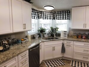 affordable kitchen renovation ideas featuring stock cabinetry and granite